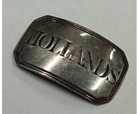 A George III silver decanter label for 'Hollands'. Birmingham. Approx. 4 grams. Est. £10 - £20.