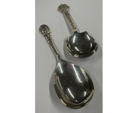 Two chased silver caddy spoons. Birmingham. Approx. 28 grams. Est. £20 - £30.