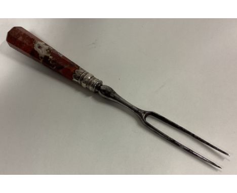 An early 18th Century silver two-prong fork. Approx. 58 grams. Est. £100 - £150.