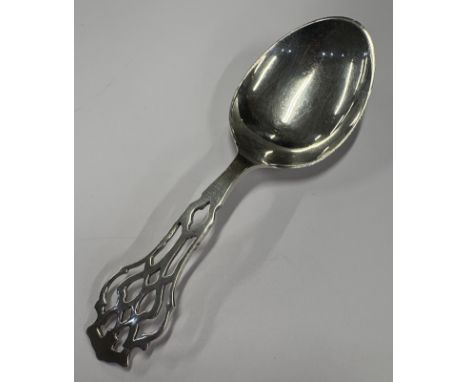 A stylish silver caddy spoon with pierced decoration. Approx. 11 grams. Est. £20 - £30.