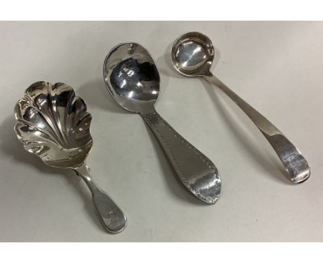 A group of three silver caddy spoons. Various dates and makers. Approx. 38 grams. Est. £30 - £50.