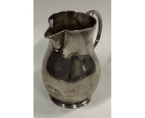 A George I silver pitcher cream jug. London 1723. By Meshach Godwin. Approx. 81 grams. Est. £200 - £300.