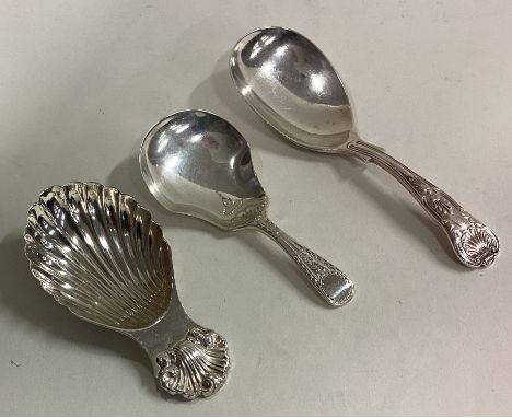A group of three silver caddy spoons. Various dates and makers. Approx. 56 grams. Est. £30 - £50.