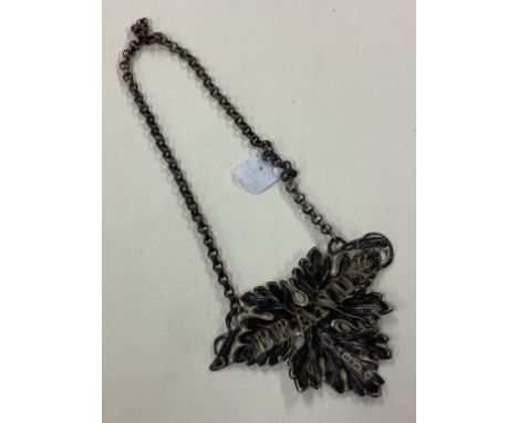A Victorian cast silver decanter label for 'Brandy' in the form of a leaf. Birmingham. By George Unite. Approx. 10 grams. Est
