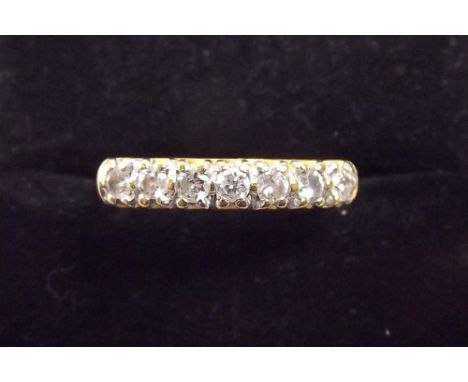 An 18 carat gold seven stone diamond ring 