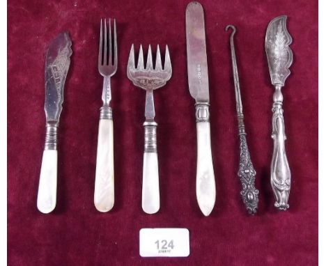 A Victorian silver butter knife, silver handled button hook and four items of silver plated and mother of pearl cutlery 