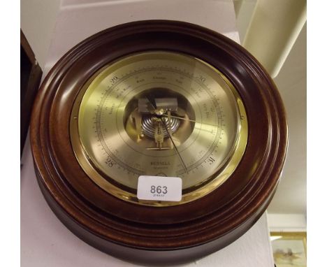 A modern mahogany circular framed barometer by Russell of Norwich