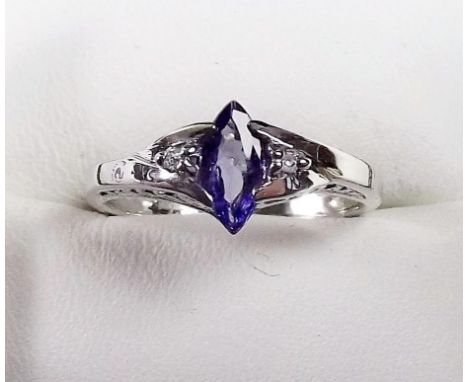 A 9ct white gold tanzanite and chip diamond ring 
