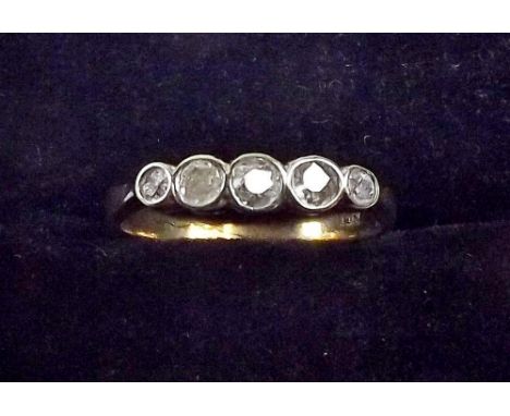 An 18ct gold ring set five graduated old cut diamonds 