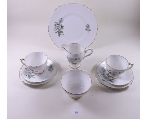 A Delphine part tea service comprising: four cups and saucers, five tea plates and a cake plate 