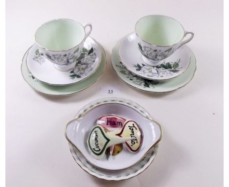 A Royal Stafford tea service printed white roses comprising: eight cups and saucers, eleven tea plates and other tea ware