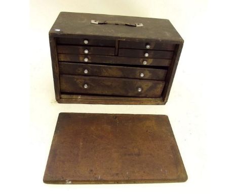 A Victorian carpenters tool box with fitted drawers - in need of some attention