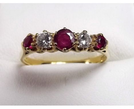 An 18ct gold ruby and diamond five stone ring 