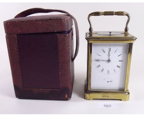 A 19th century brass carriage clock with repeat striking movement in leather case, with key 