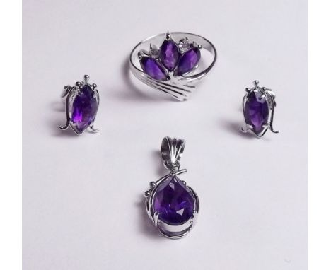 A rhodium plated gold ring pendant and earrings set amethysts