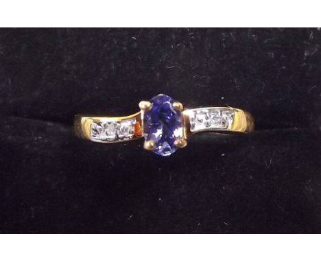 A 9ct gold tanzanite and diamond ring 
