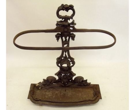 A Victorian cast iron stick stand with scrollwork decoration 