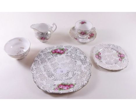 A floral printed teaset comprising six cups and saucers, cake plate and six tea plates 