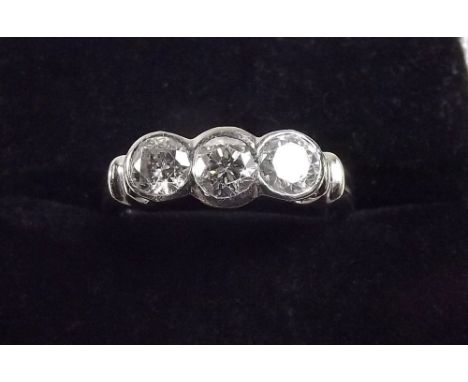 An 18ct white gold ring set three diamonds (total diamond weight one carat)