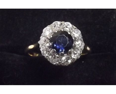 An 18ct gold sapphire and diamond cluster ring 