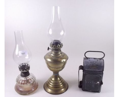 A 'John Phillips' hand lamp and two oil lamps