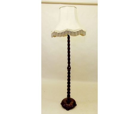 An oak bobbin turned standard lamp and shade