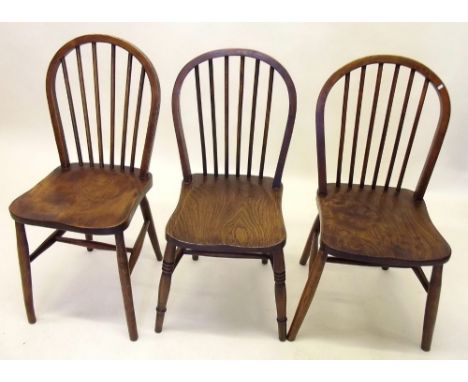 Three antique elm seated stick back chairs 