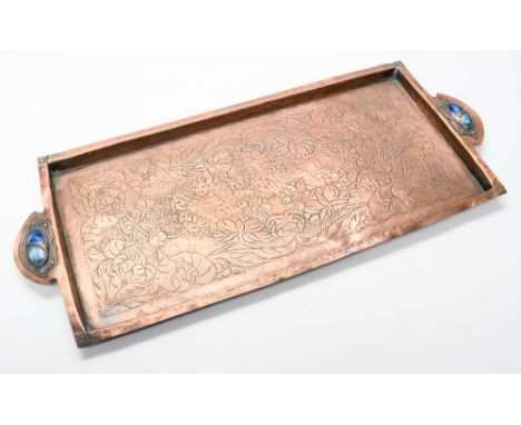 An Arts and Crafts copper tray, rectangular form with handles set with Ruskin type enamelled ceramic cabouchons, a chased fol