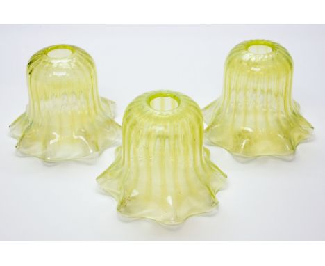 Three Arts and Crafts straw opal glass light shades, vertically ribbed, flared form with crimped edges, probably John Walsh W