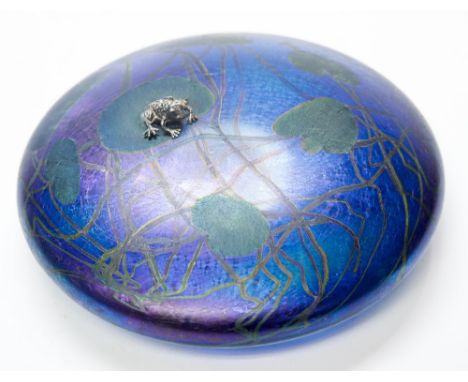 John Ditchfield for Glasform, a studio glass iridescent paperweight, with lily pad design and applied silver frog, signed to 