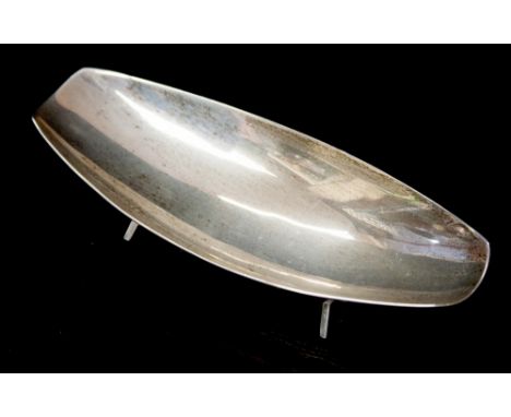 A modernist silver dish, possibly designed by Geoffrey Bellamy, of boat form on tressle feet, A E Jones, Birmingham 1966, 13c