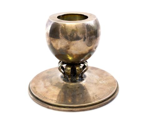 C C Hermann, a Danish silver candlestick, circa 1950, the hemispherical bowl supported on an open cage of straps in the form 