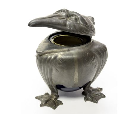 Joseph Reinemann, Munich, a Jugendstil pewter novelty inkwell in the form of a grotesque bird, with blue ceramic liner, on th