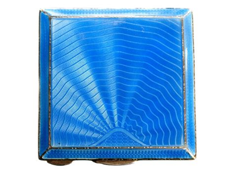 An Art Deco style silver and guilloche enamel compact, square form with bevelled edges, enamelled in blue with engine turned 