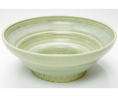 Susie Cooper, a Studio Ware bowl, pale green, ogee form with ribbed decoration and incised leaf design to the foot, signed to