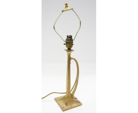 An Art Nouveau brass table lamp, secessionist style, square section with loop handle, 35cm high with fitting