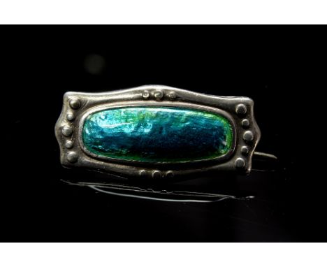 Charles Horner, an Arts and Crafts silver and enamelled brooch, shaped rectangular form with blue and green enamel centre, in