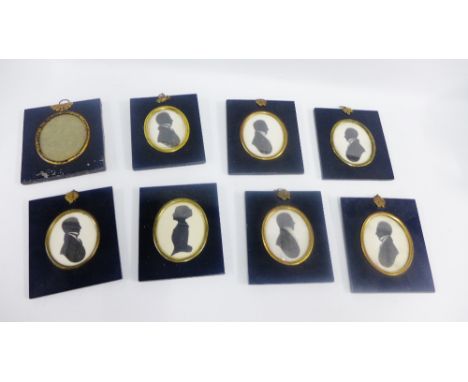 Group of seven silhouette portrait miniatures together with a toile ware frame (8) 