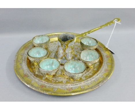 Eastern mixed metal inlaid brass tea / coffee set comprising a pot, six cups with ceramic liners and a circular tray, (8) 