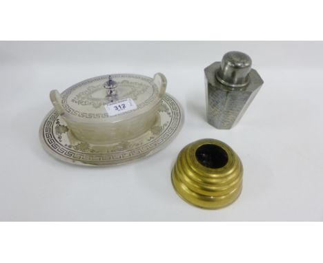 Mixed lot to include an Epns and glass butter dish, a pewter caddy and a brass shell case inkwell (3)