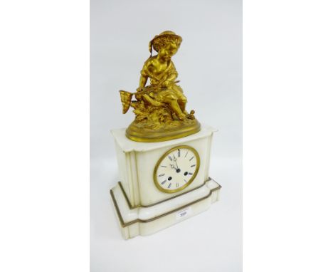 White hardstone mantle clock, the enamel dial surmounted by an ormolu figure, 38cm high 