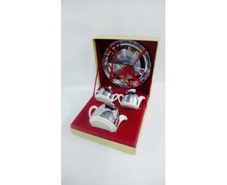 Three piece chrome covered ceramic teaset 