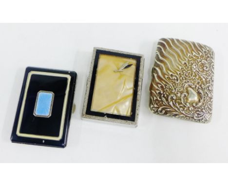 Three cigarette cases to include a black enamel case with blue guilloche panel, etc (3) 