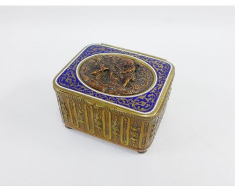 Musical box, the hinged lid with blue enamel border and inset copper plaque with figures, on four bun feet, 9.5 x 6cm 