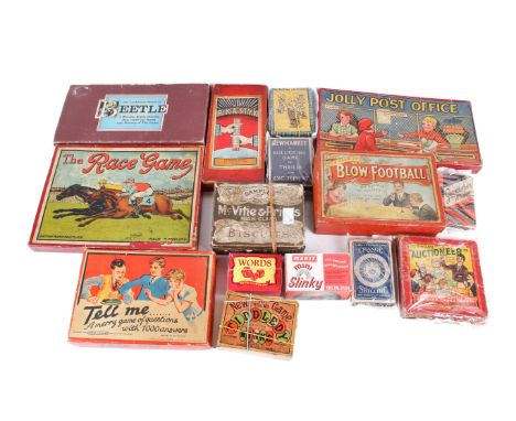 An assortment of vintage games. Including a jigsaw puzzle featuring a map of England and Wales, 'Blow Football', 'The Race Ga