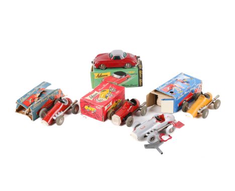 Five Schuco clockwork Micro Racer cars. Comprising a 1040 in yellow, boxed with the instructions and key, a boxed 1047 Porsch