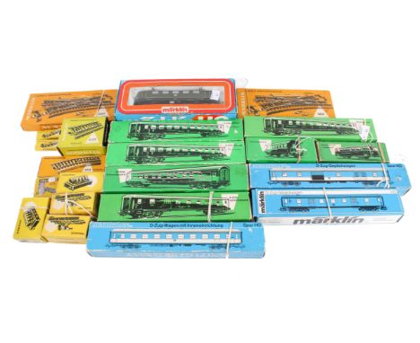 An assortment of second half 20th Century HO gauge Marklin model railway items. Including an electric locomotive #3037, railb