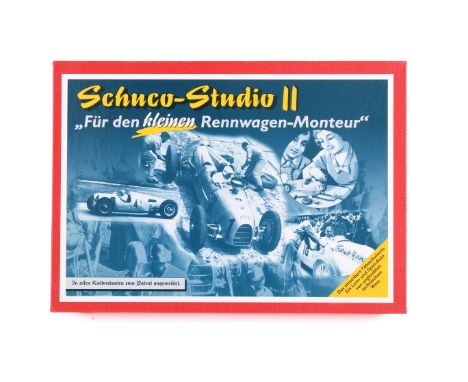 A Schuco modern Studio II 'Montagekasten' tinplate clockwork car kit set. Art. Nr. 01222, with a silver racing car, tools, wh