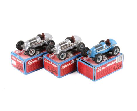 Three Schuco Studio tinplate clockwork racing cars. All Art.-Nr. 1050, one in blue No.8, the other two in silver No.9 and No.