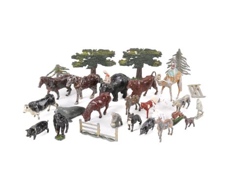 A collection of lead painted animals. Including an elephant, a Britains Walrus, a gorilla with a hinged arm, a Timpo Toys cow